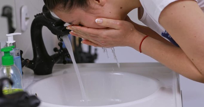 Woman wakes from sleep and she was cleansing her face
