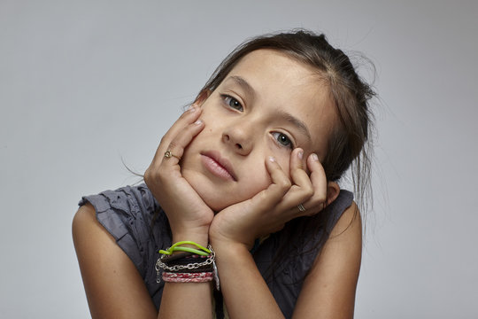 Girl with head in hands