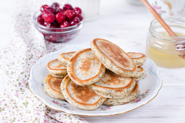 Homemade pancakes with poppy seeds with honey for tasty healthy breakfast