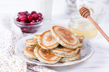 Homemade pancakes with poppy seeds with honey for tasty healthy breakfast