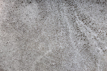 Bubbles are dispersed in water containing chemicals.