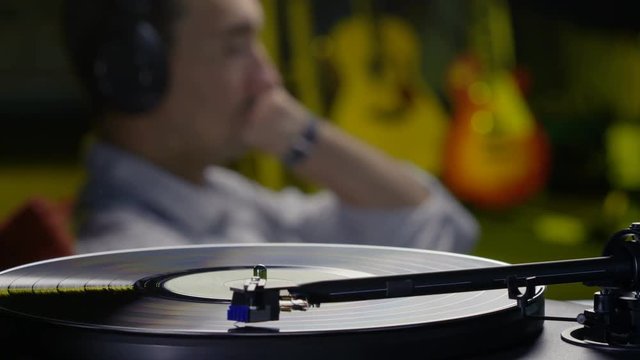 Man listening to records on a turntable