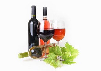 wineglass, bottle of wine and grapes leaf