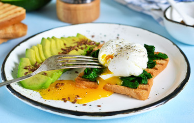 Quick breakfast - poached egg with toast, spinach and avocado.