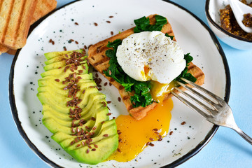 Quick breakfast - poached egg with toast, spinach and avocado.