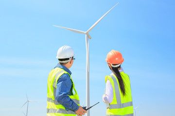 Engineers are investigating the wind turbine.