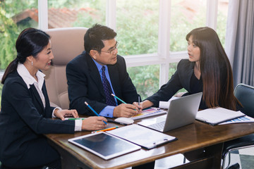 Indoor business meeting, young woman advice information to her team