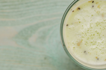 Glass with kiwi smoothies, top view