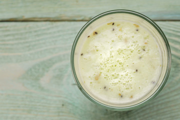 Glass with kiwi smoothies, top view