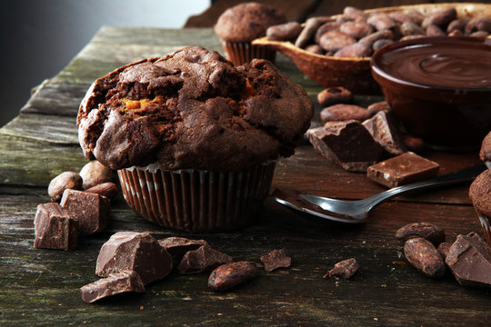 Chocolate muffins, homemade bakery on wooden background