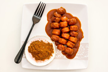Tasty german sausage served with sauce