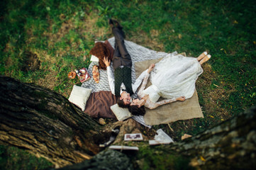 Attractive Couple Enjoying Romantic Sunset Picnic in the Country