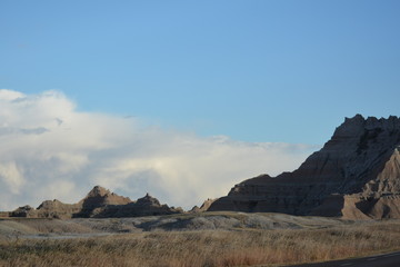 Fototapeta na wymiar Prairie grass rocks and blue sky ... Badlands
