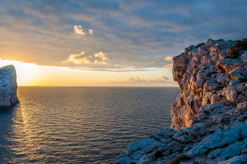 Fototapeta na wymiar Closeup of rocks on the coast at sunset