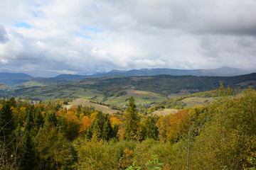 View of mountains and valley from Veretskyi Pass in autumn day before rain.