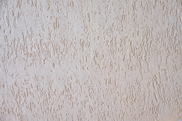 Texture background with decorative relief plaster on the wall