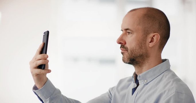 Businessman using facial recognition technology
