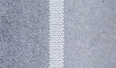 Texture of dry asphalt with white road markings, vertical tile