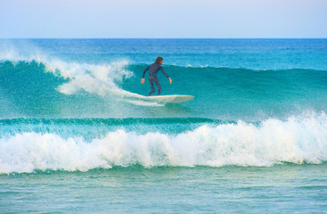 Surfer surfing on a wave