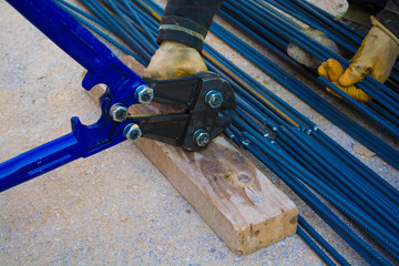 industrial construction worker cutting steel