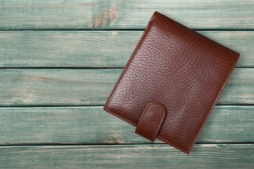 Leather wallet on wood desk