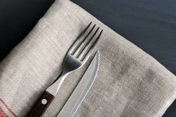 knife and fork on the linen tablecloth