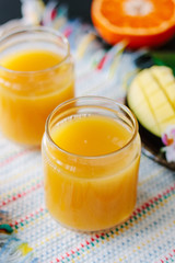 Mango and orange detox juice made from fresh fruits.