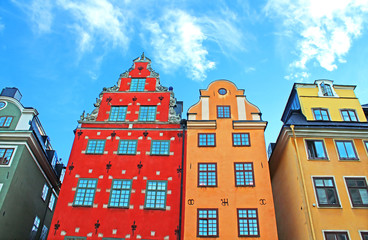 Fototapeta premium Red and Yellow iconic buildings on Stortorget, a small public square in Gamla Stan, the old town in central Stockholm, Sweden