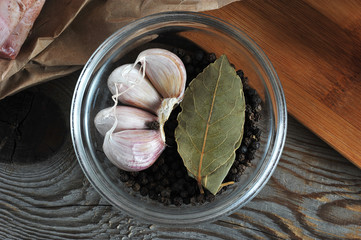set of spices in glass bowl - garlic, pepper, Bay leaf