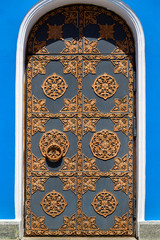 An old black door with forging.