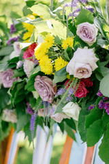 Close up view of flowers on wedding arch