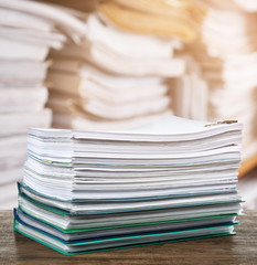 Stack of documents on table in archive