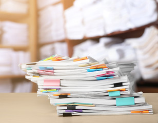 Stack of documents on table in archive