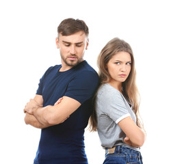 Fototapeta premium Unhappy young couple on white background. Problems in relationship