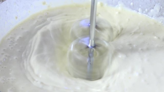 Beating batter, zooming in close
