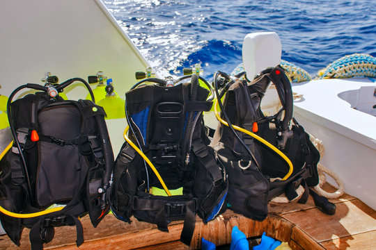 Equipment for scuba diving on boat of ship. Picture of aqualungs for diving.