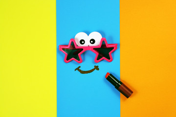 Smiley face on multicolored background