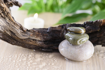 Spa Still Life, Stones and wood on green background