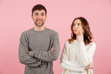 Portrait of young loving couple dressed in sweaters