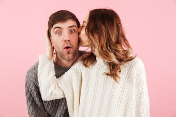 Portrait of pretty loving couple dressed in sweaters