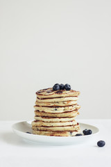 blueberry pancakes on white background