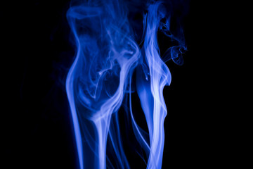 Blue smoke on black background