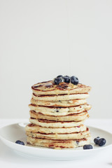 blueberry pancakes on white background