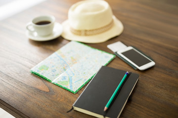 Desk of a traveler preparing for a trip