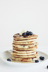 blueberry pancakes on white background