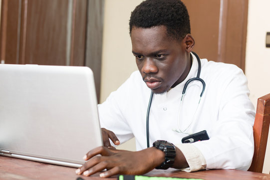 doctor with stethoscope and a laptop.