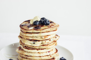 blueberry pancakes on white background