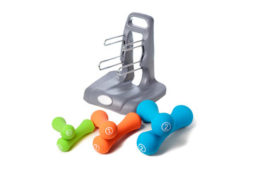 Set of colored isolated dumbbells for sport on a white background folded near to the a special gray...