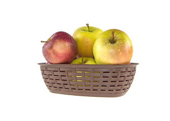 wet apples in a basket on a white background