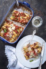 Cannelloni con ricotta e salca di Pomodoro as top view in a roasting pan